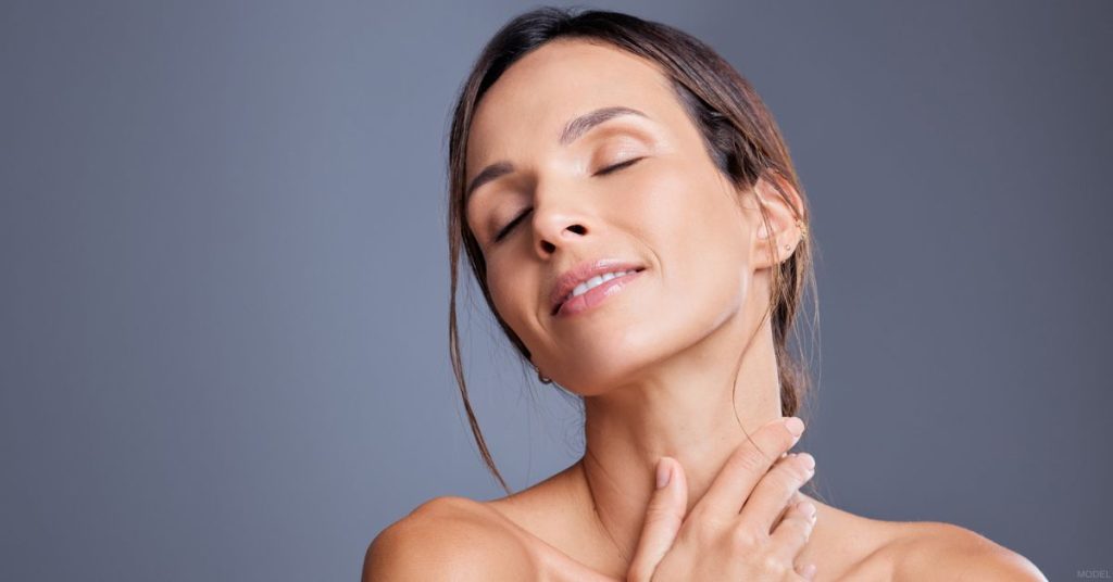 Woman showing off her facelift and neck lift results (model)