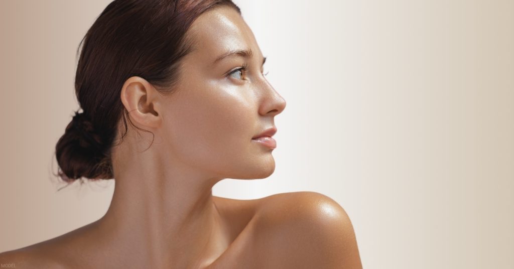 Woman shown in profile highlighting results after rhinoplasty. (Model)